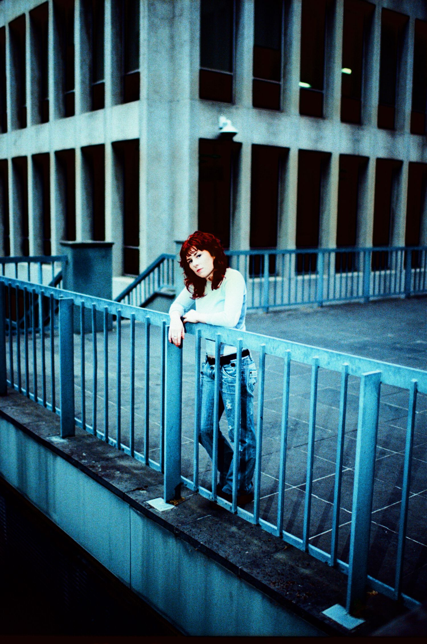 Lucky standing over a railing